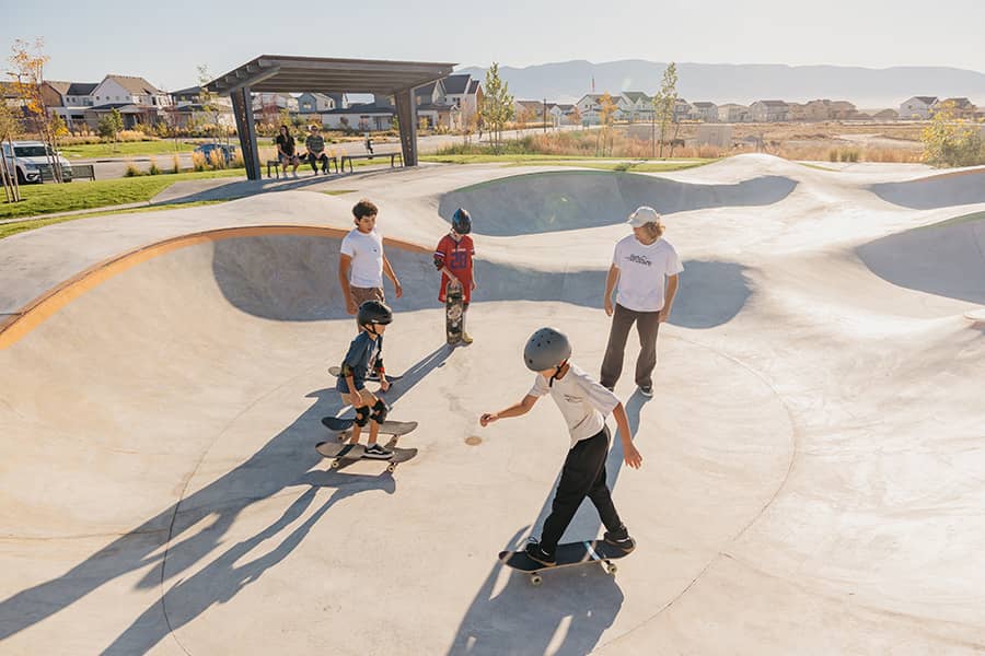 Children skateboarding at the Firefly wheels park